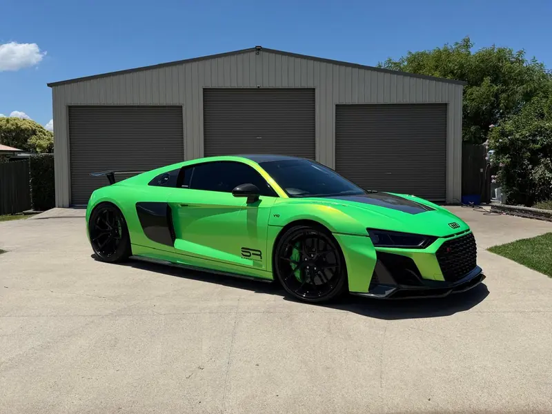 Green Audi R8 V10 detailed in front of the garage