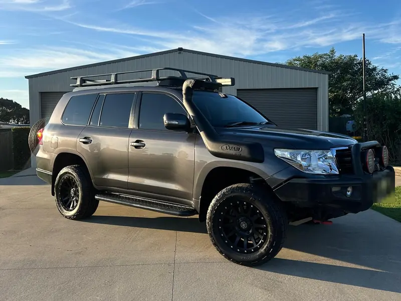 Toyota LandCruiser with a bull bar cleaned up outside the garage