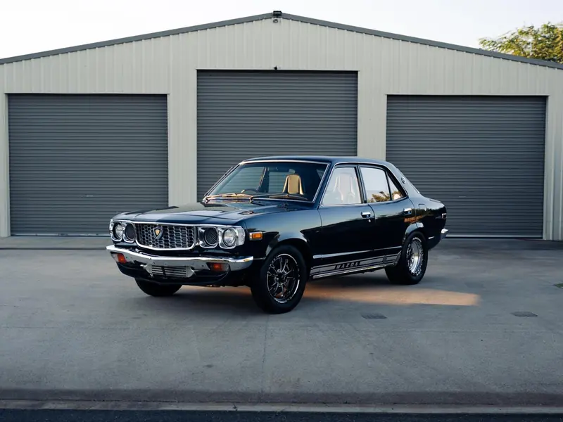 Restored classic black Mazda with polished chrome trim
