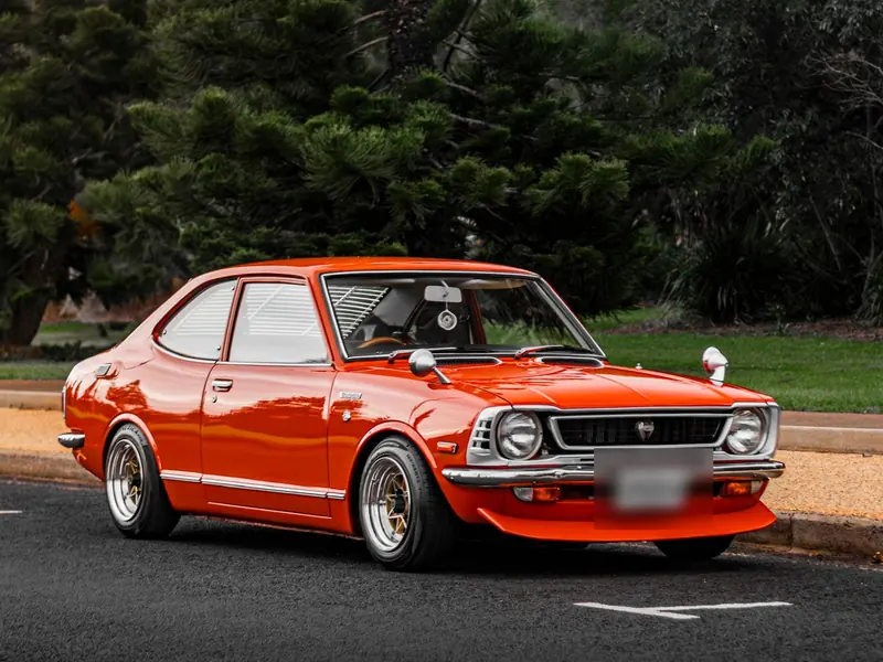 Restored orange Toyota Corolla KE20 detailed to a deep gloss