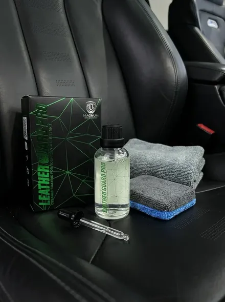Magnum Leather Guard Pro Ceramic Coating box, bottle and pipette on a black leather seat