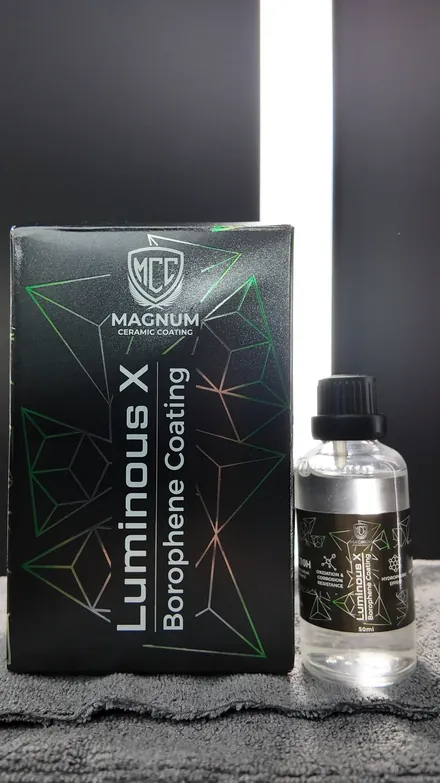 Magnum Luminous X Borophene Coating box and 50ml bottle on a grey towel