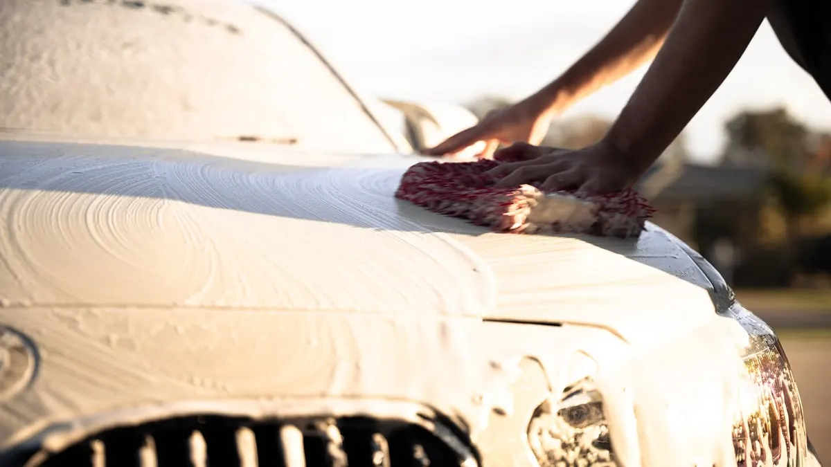 Thick foam contact wash on a bonnet during a maintenance wash